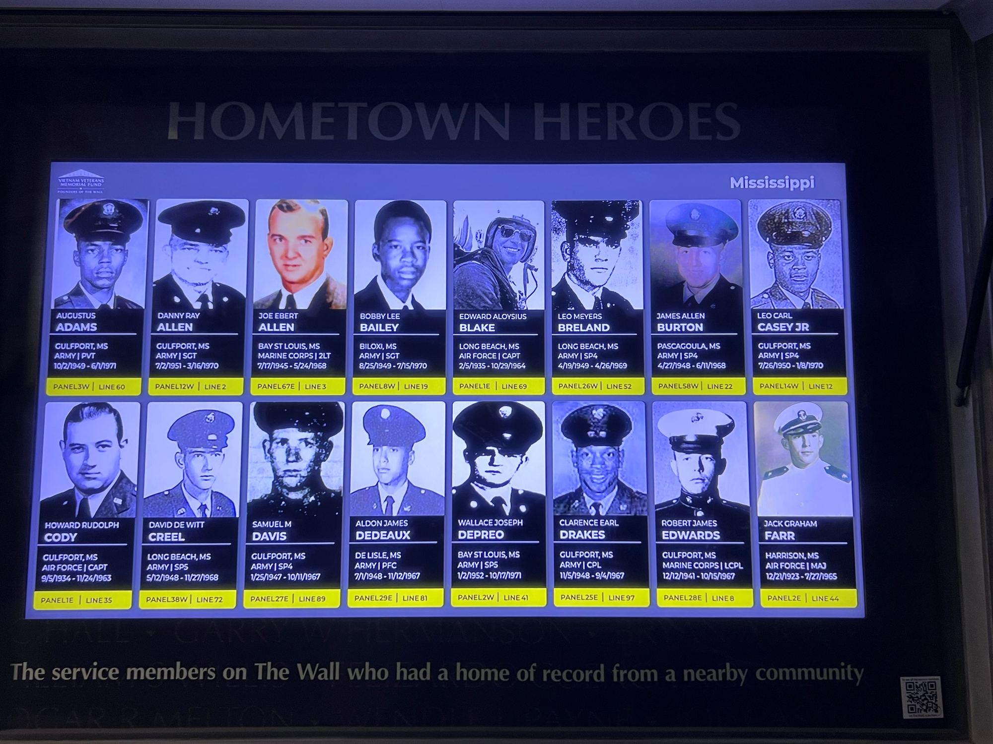 The Hometown Heroes digital display showing photographs of local service members on The Wall